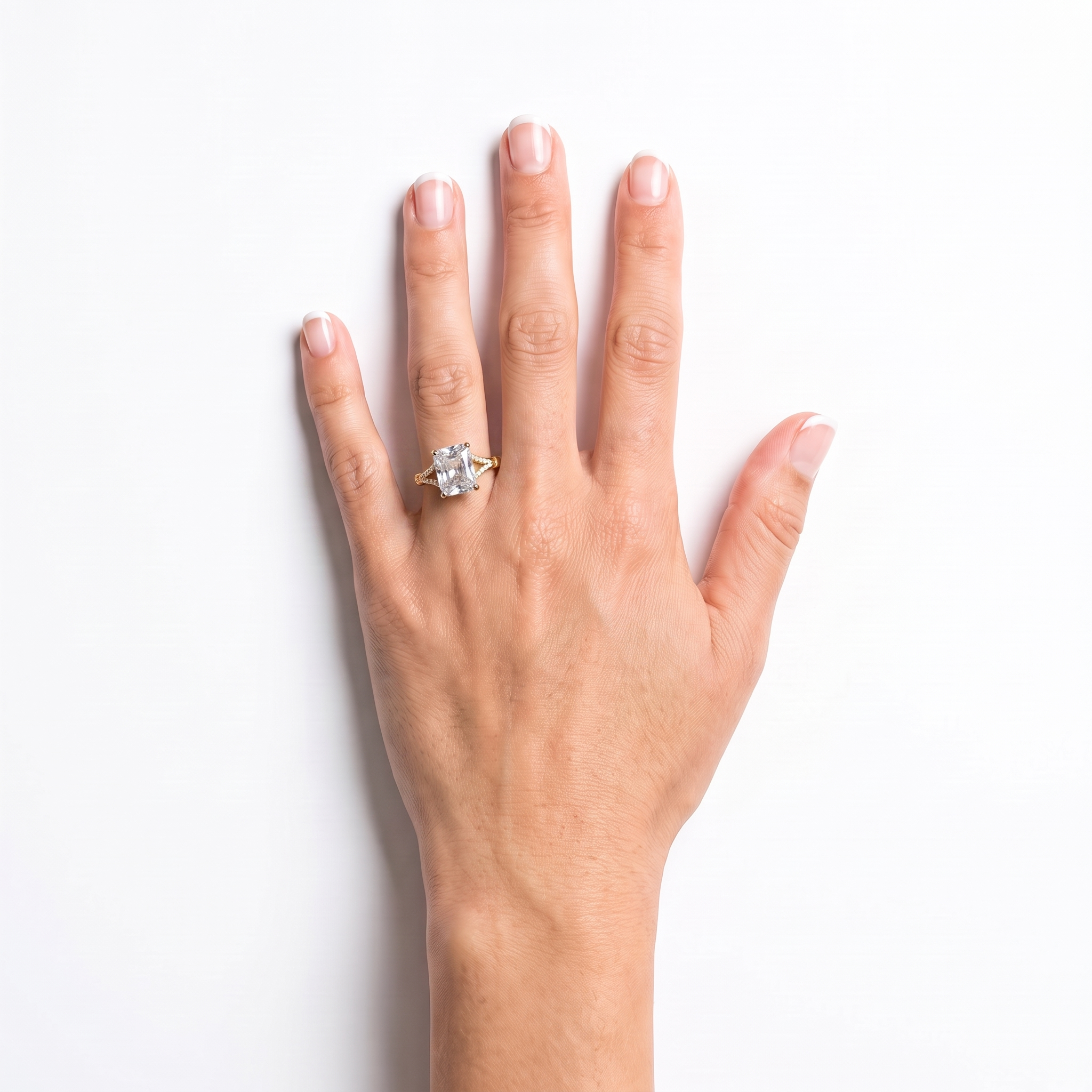 Radiant cut diamond engagement ring worn on the left hand ring finger