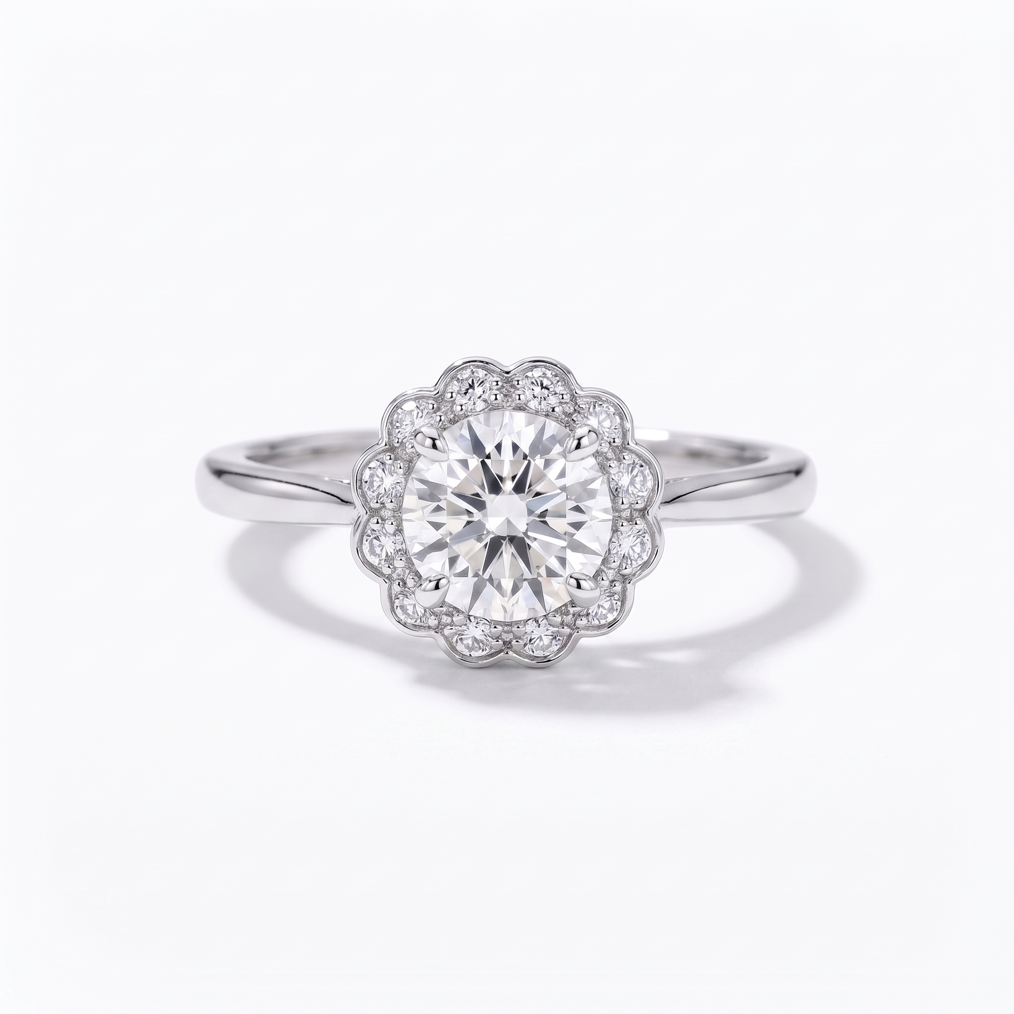 Vintage floral halo engagement ring, top view, white gold shown
