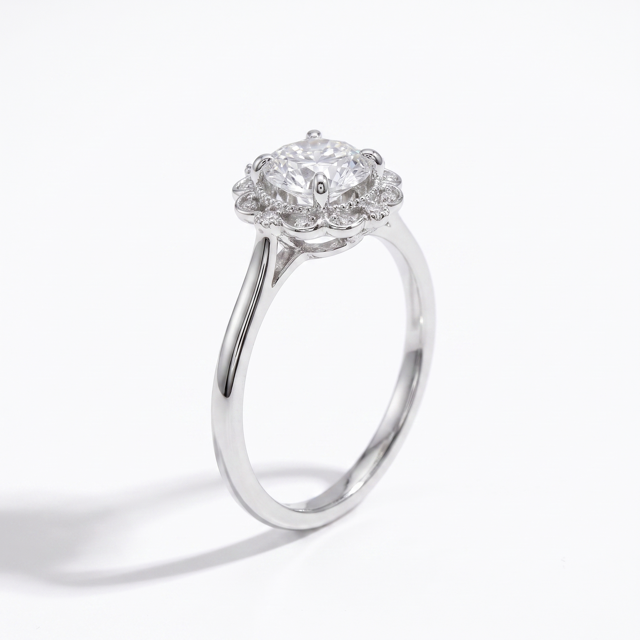 Vintage floral halo engagement ring, angled view, white gold shown (superseded)