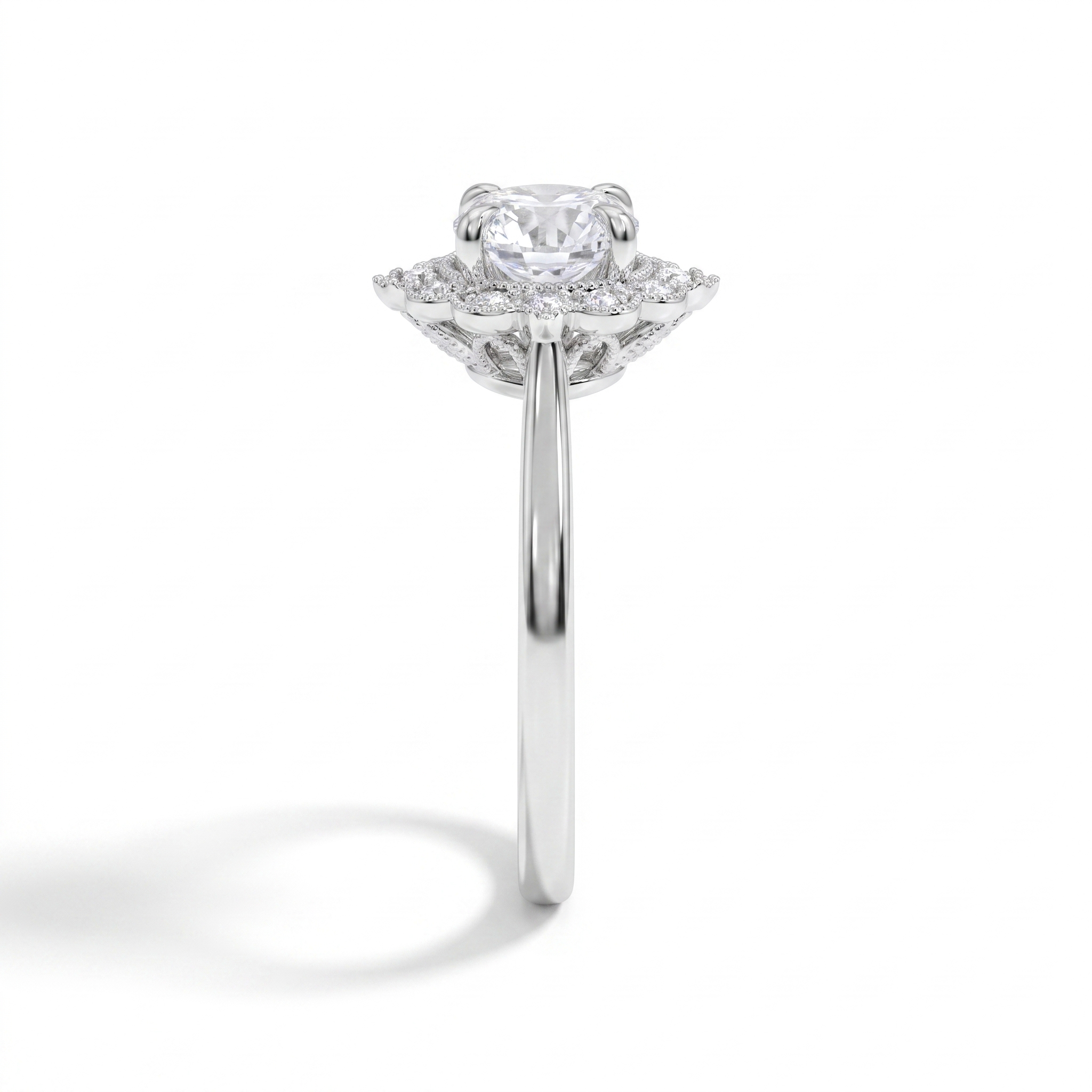 Vintage floral halo engagement ring, side profile, white gold shown