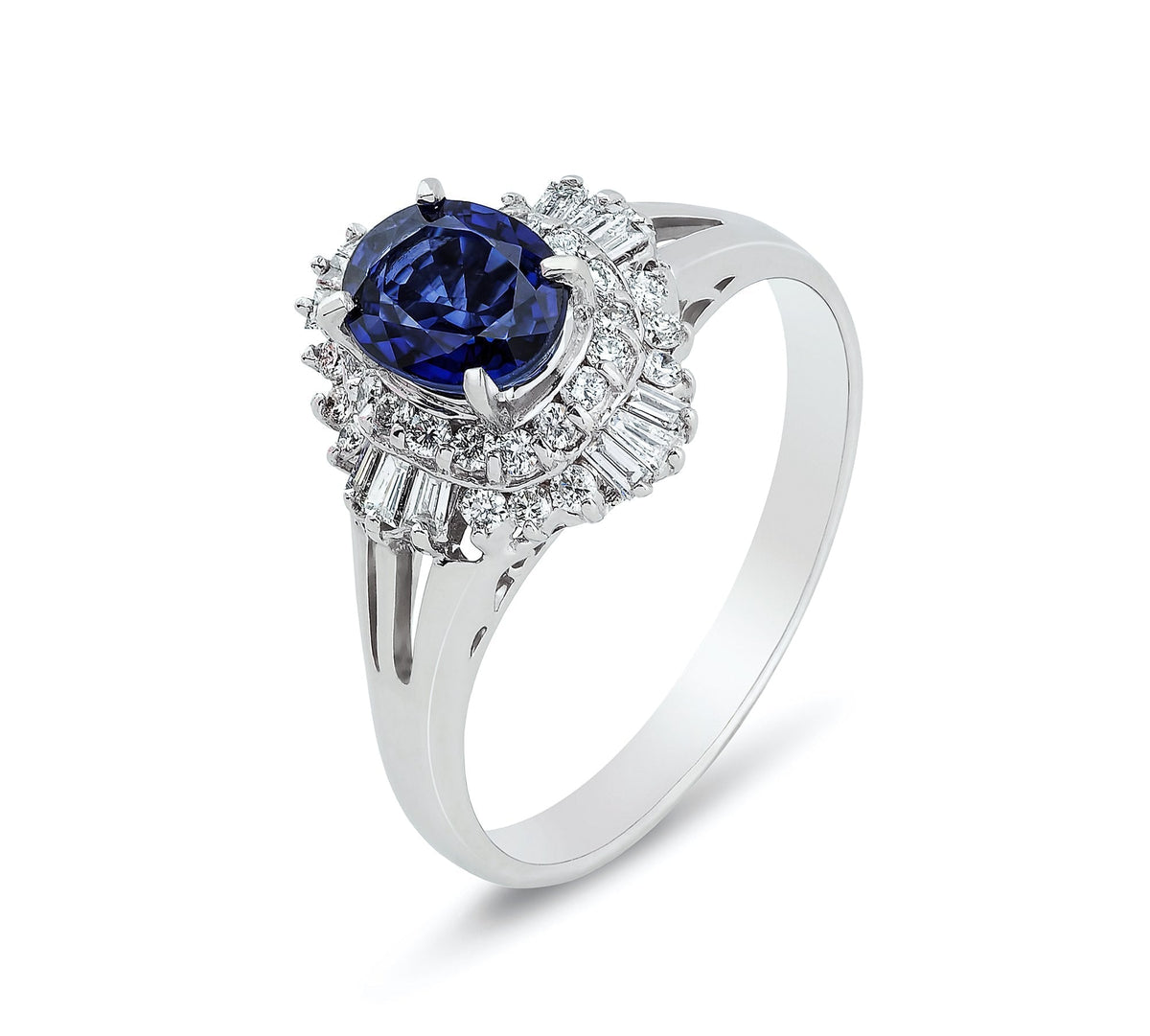 Oval sapphire engagement ring with a diamond halo on a split-shank band