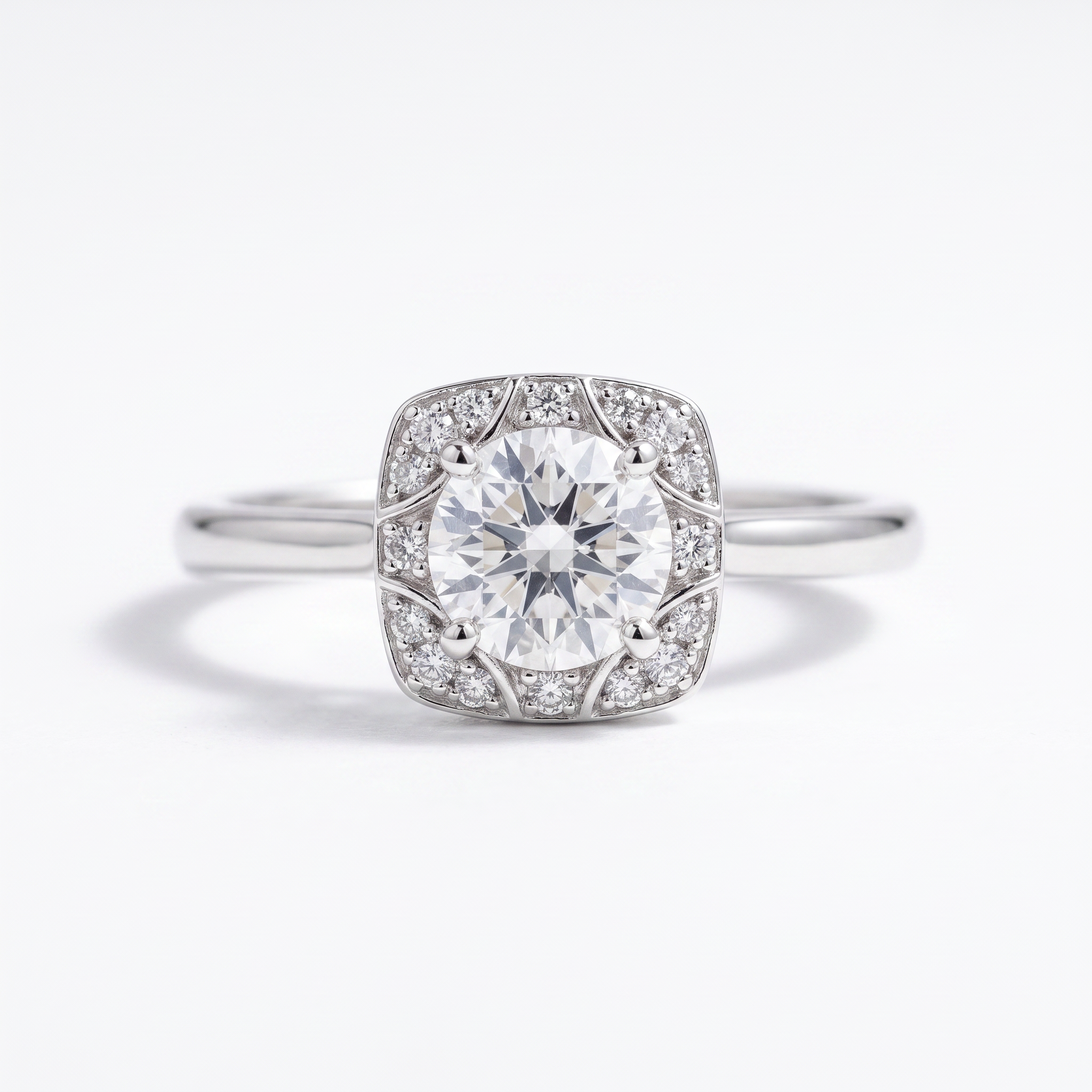Round cushion halo engagement ring, top view, white gold shown