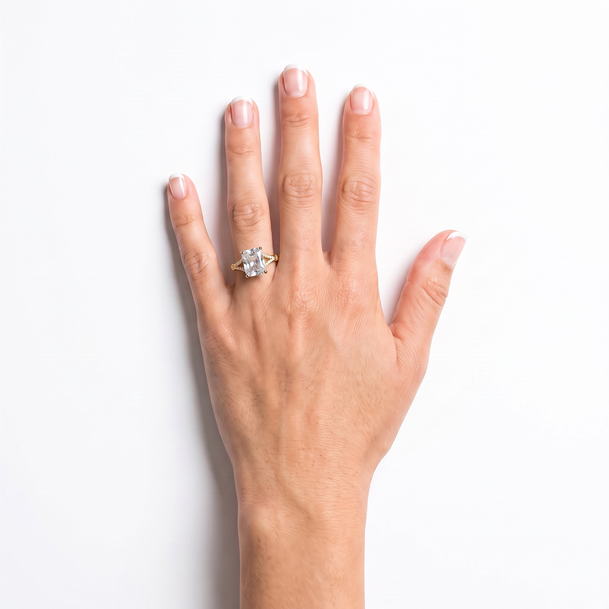 Radiant cut diamond engagement ring worn on the left hand ring finger