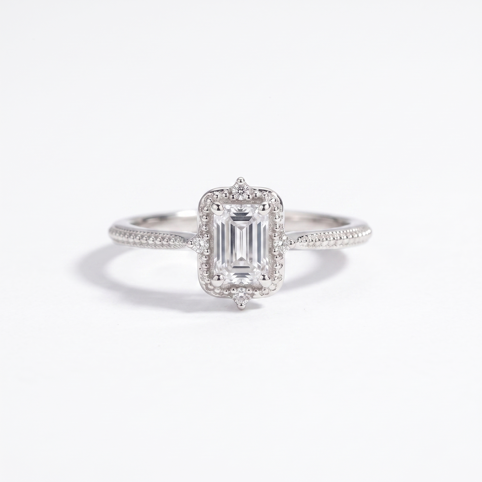 Emerald-cut halo engagement ring, top view, white gold shown