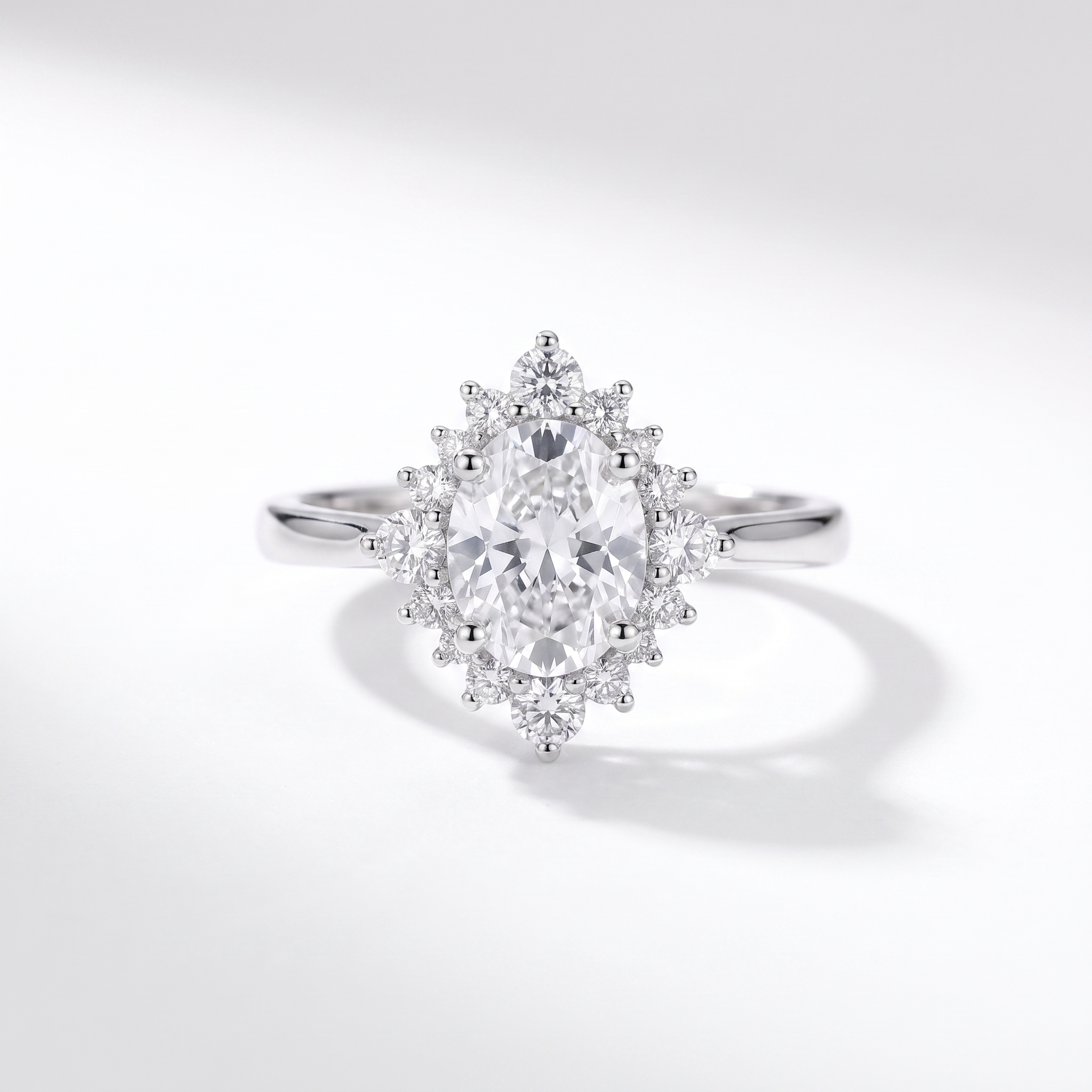 Oval halo engagement ring, top view, white gold shown