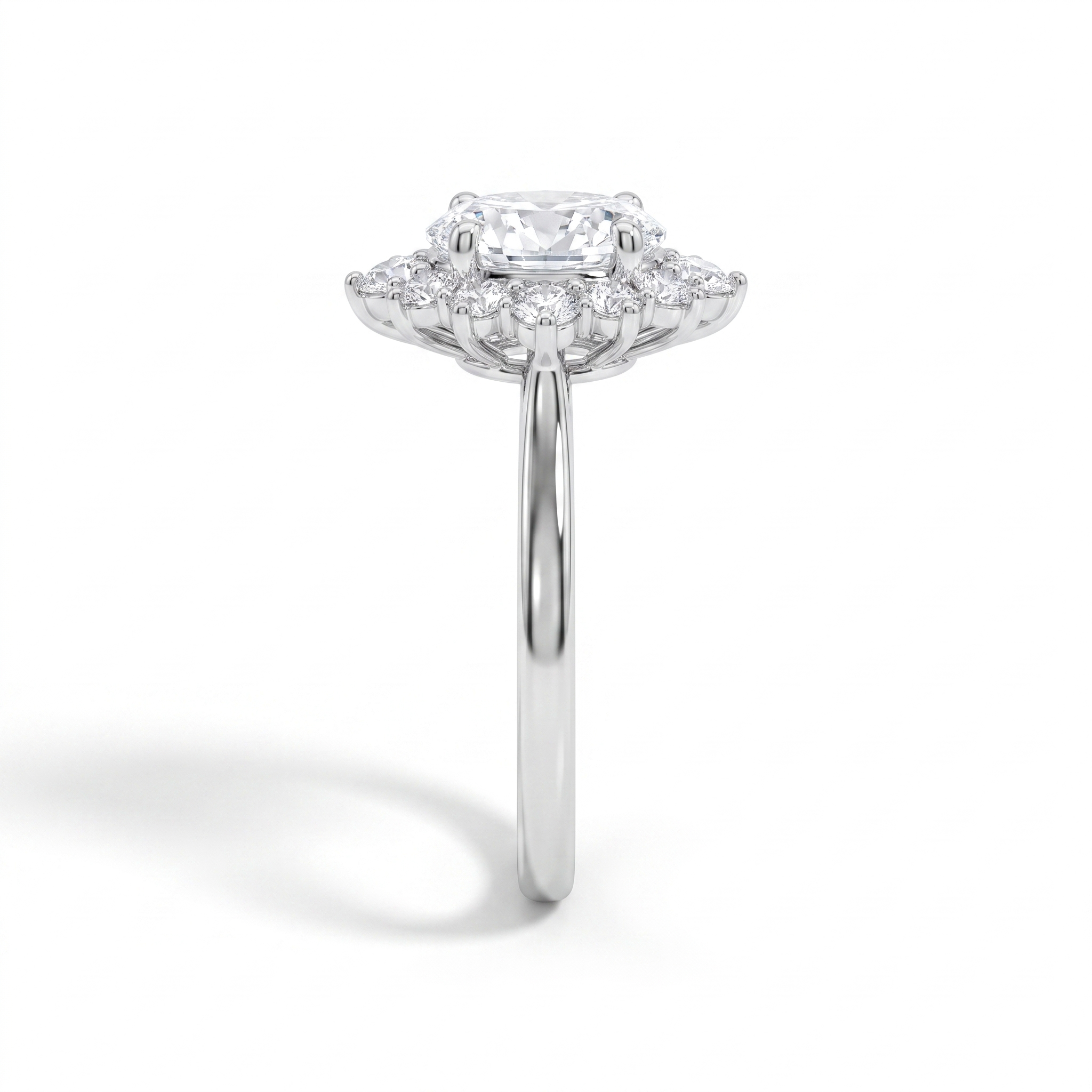 Oval halo engagement ring, side profile, white gold shown